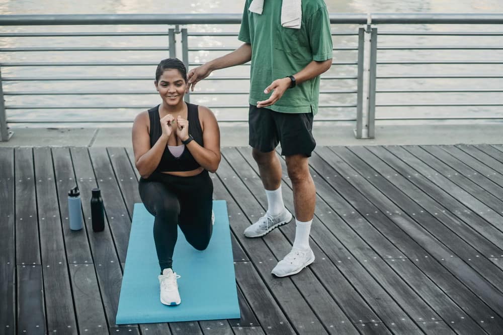A woman doing squats & lunges-Safe Workout Plans for New Moms You Should Know