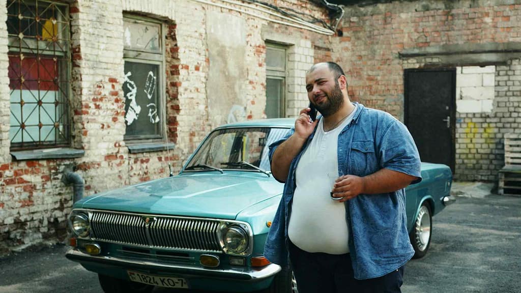 An overweight man talking on the phone-Metabolic Syndrome: A Strange Health Condition You Should Know