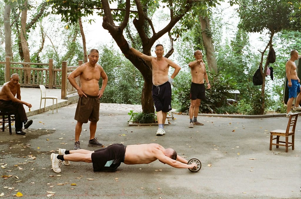 Men exercising outdoors with an ab roller wheel-How to Make Health and Fitness a Hobby