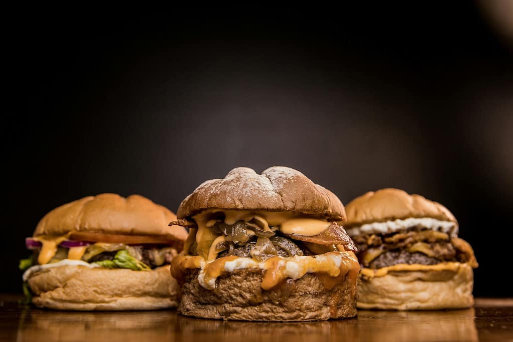 burger on brown wooden table-Important Facts You Need to Know About Gut Health