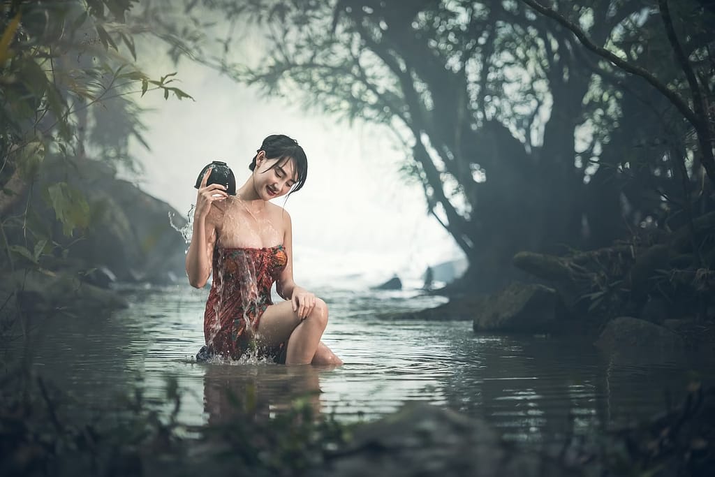 woman bathing in a river-one of the amazing healing power of nature you should know