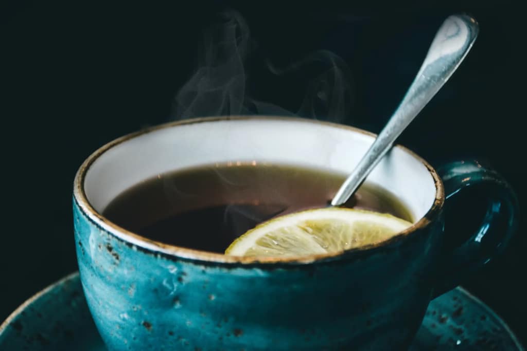 Green tea in a blue and white cup.