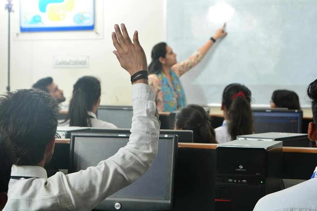 Students and teacher in a classroom-The Emotional Labor of Teacher No One Sees
