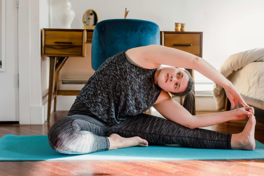 An image of a woman doing stretches at home-The Benefits of Stretching Every Morning You Should Know