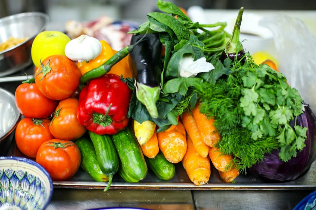 a pile of vegetables sitting on top of a table-What Current Research Really Says