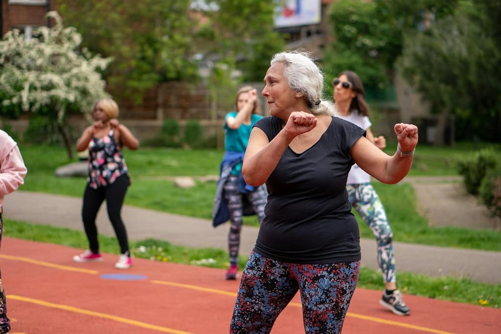a group of people on a track exercising