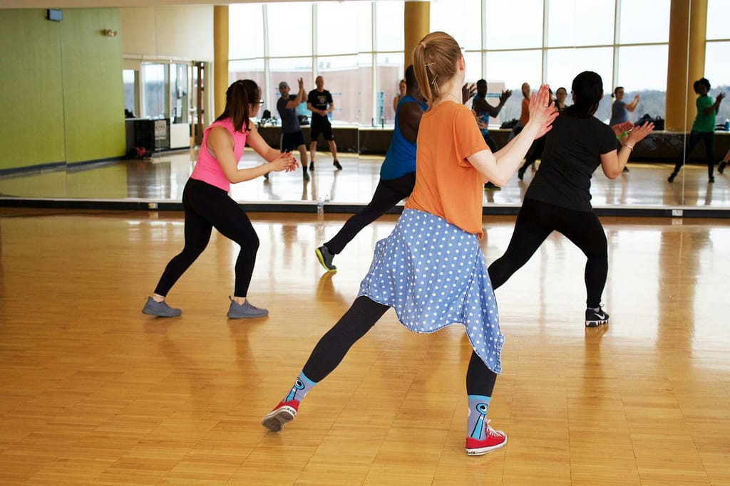 women dancing near mirror-Rewire Your Brain: The Secret to a Longer Life