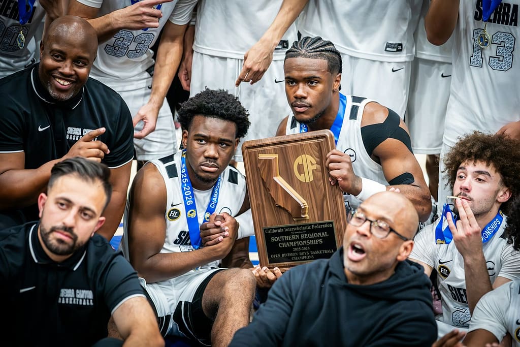 Basketball team celebrates championship win with trophy-The Strange Way Winners Are Made
