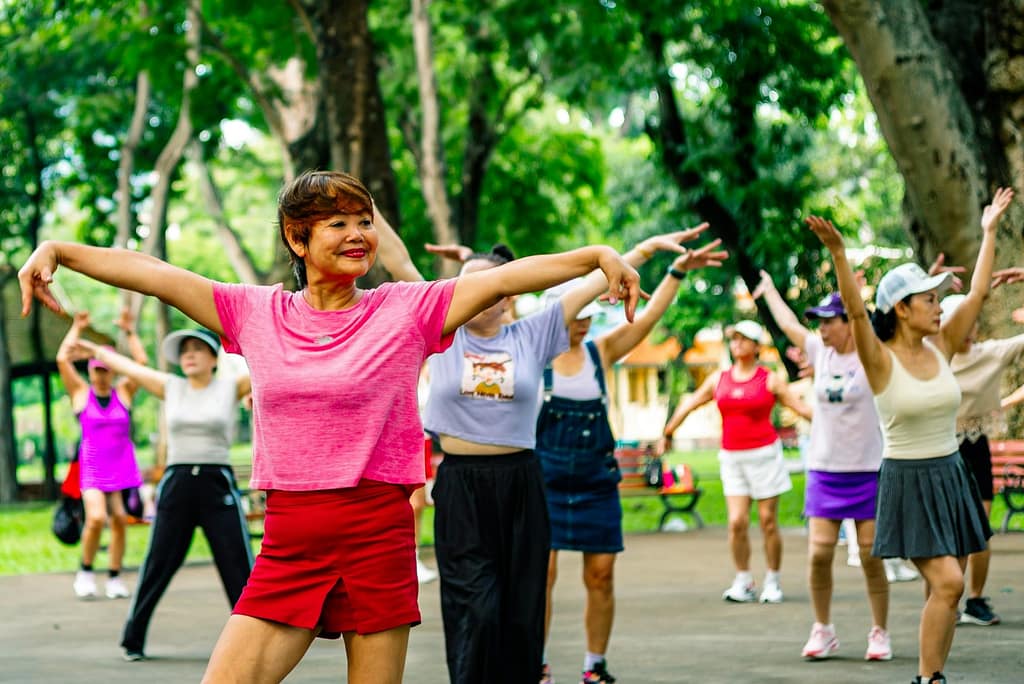 Group of women exercising together in a park-How to Make Health and Fitness a Hobby