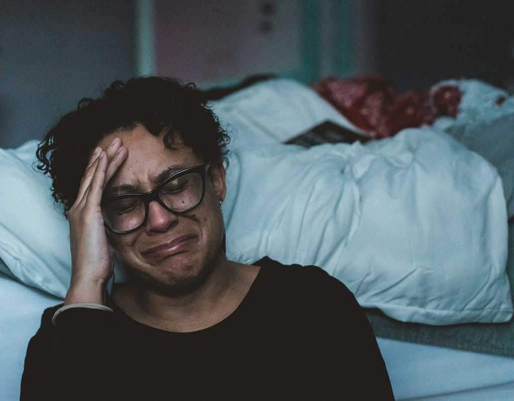person crying beside bed -The 3am Problem — What You Need To Know