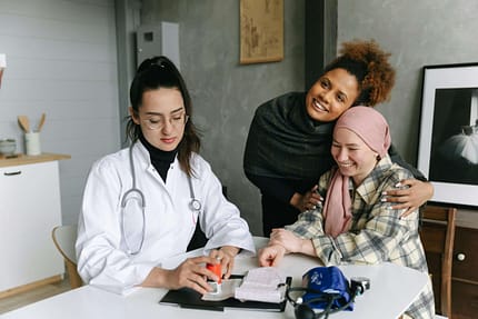 a doctor taking care of a patient with her friend