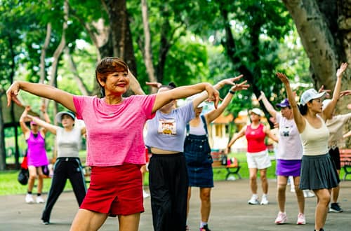 Group of women exercising together in a park-How to Make Health and Fitness a Hobby