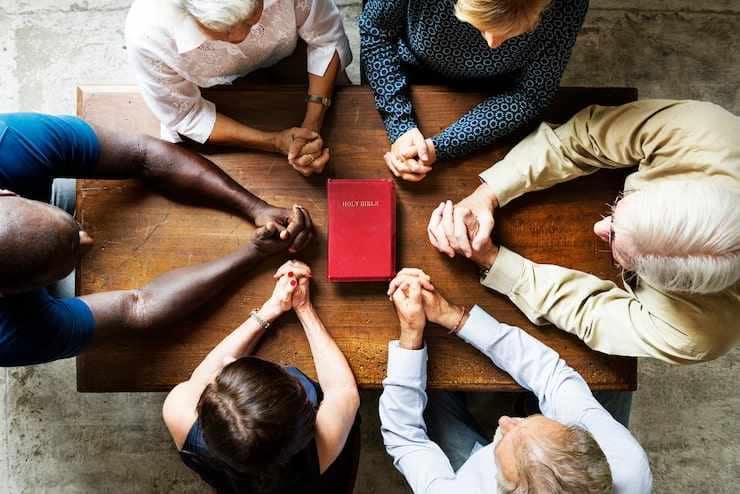 An image of people praying together-What Does Science Say About Faith, Stress, and Longevity?
