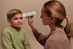 A-woman-using-BeamO-monitor-on-a-child-