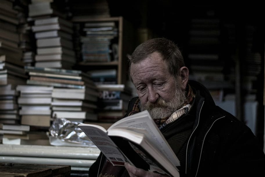 man reading books-10 Creative Ways to Improve Your Thinking Skills