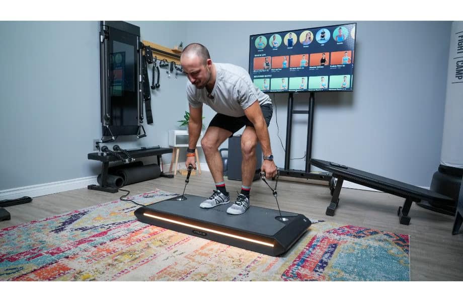 A Man Pulling Handles of Vitruvian Trainer